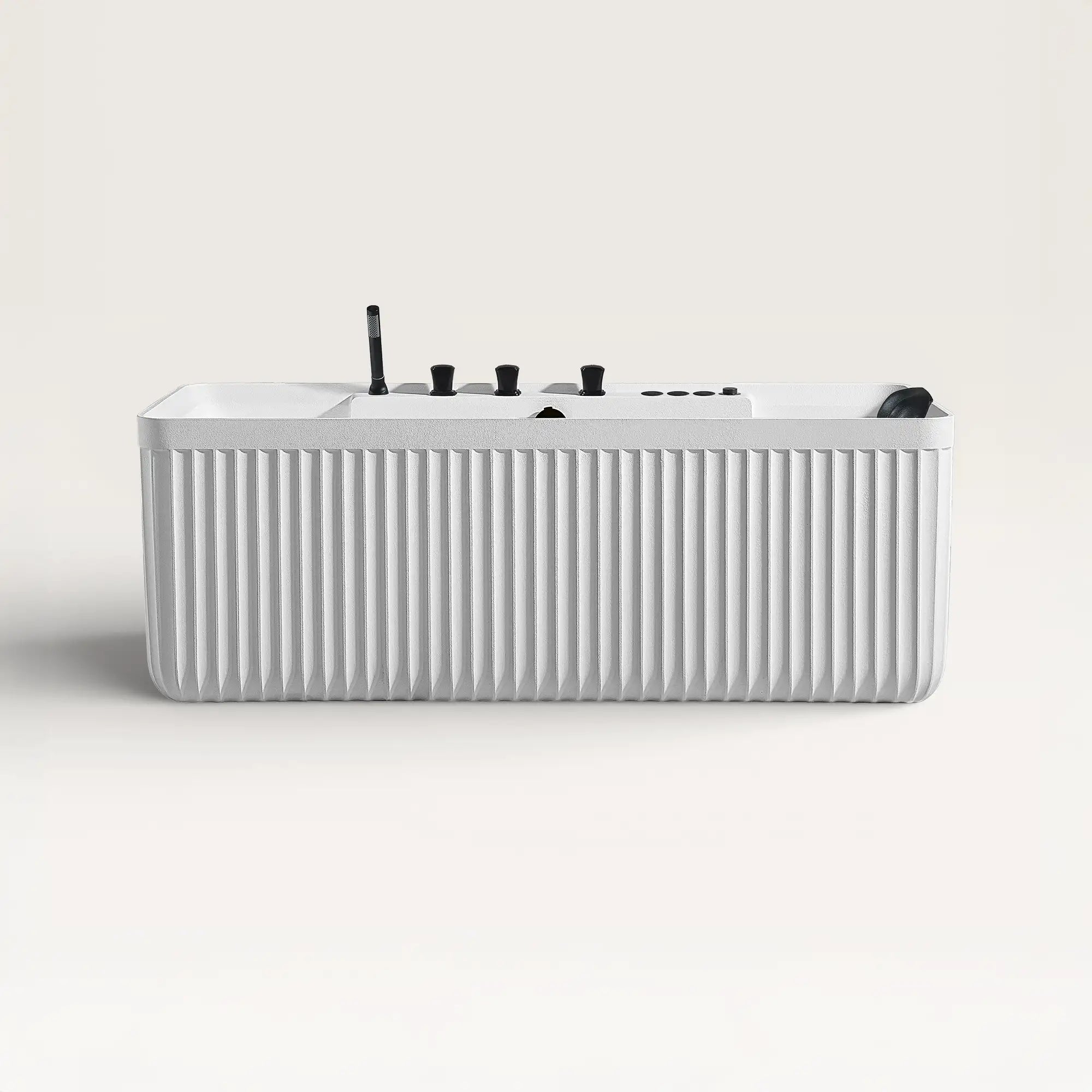 Front view of the Kolpa Spa bath with black tapware in white