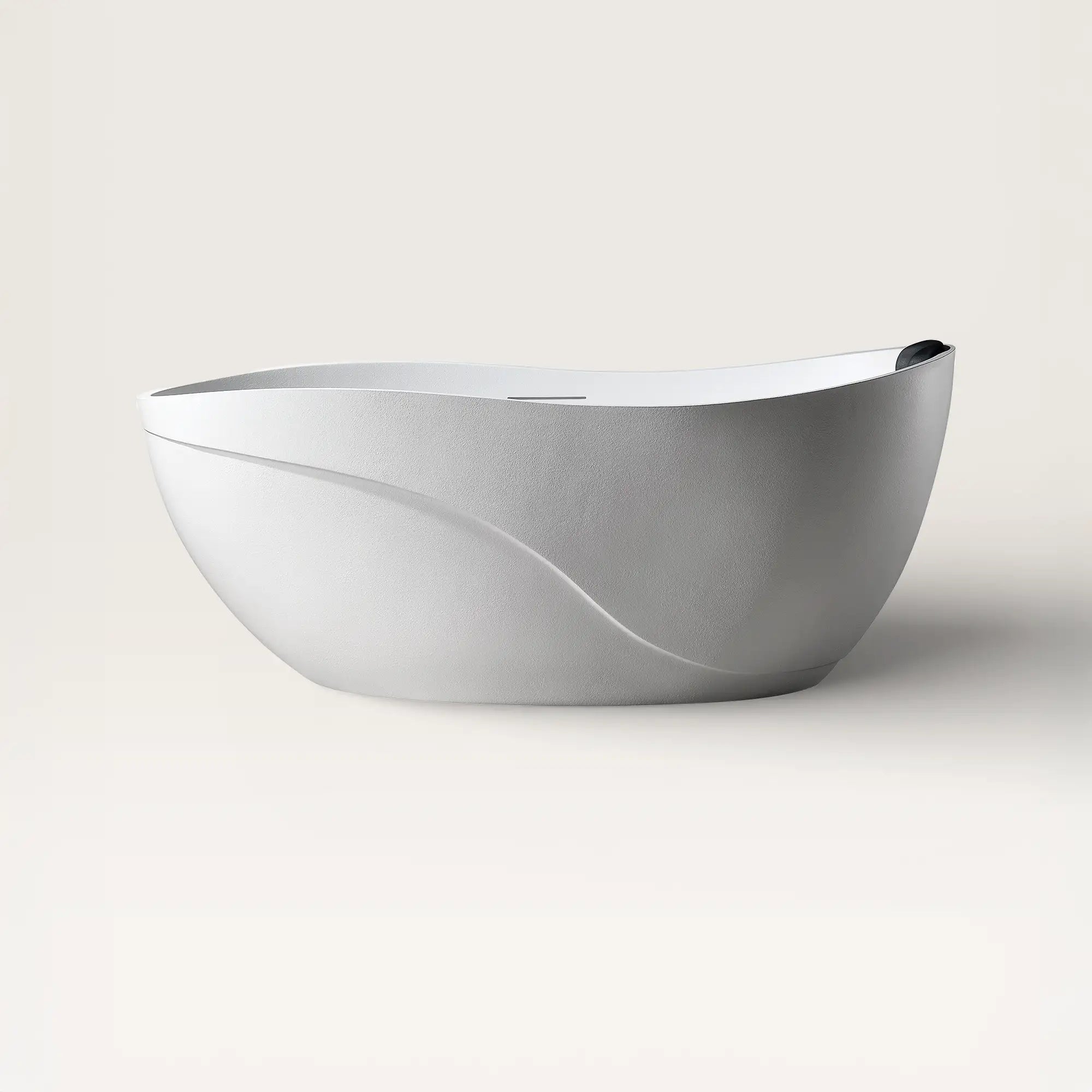 Front view of the Soma freestanding bath in white with a black magnetic pillow