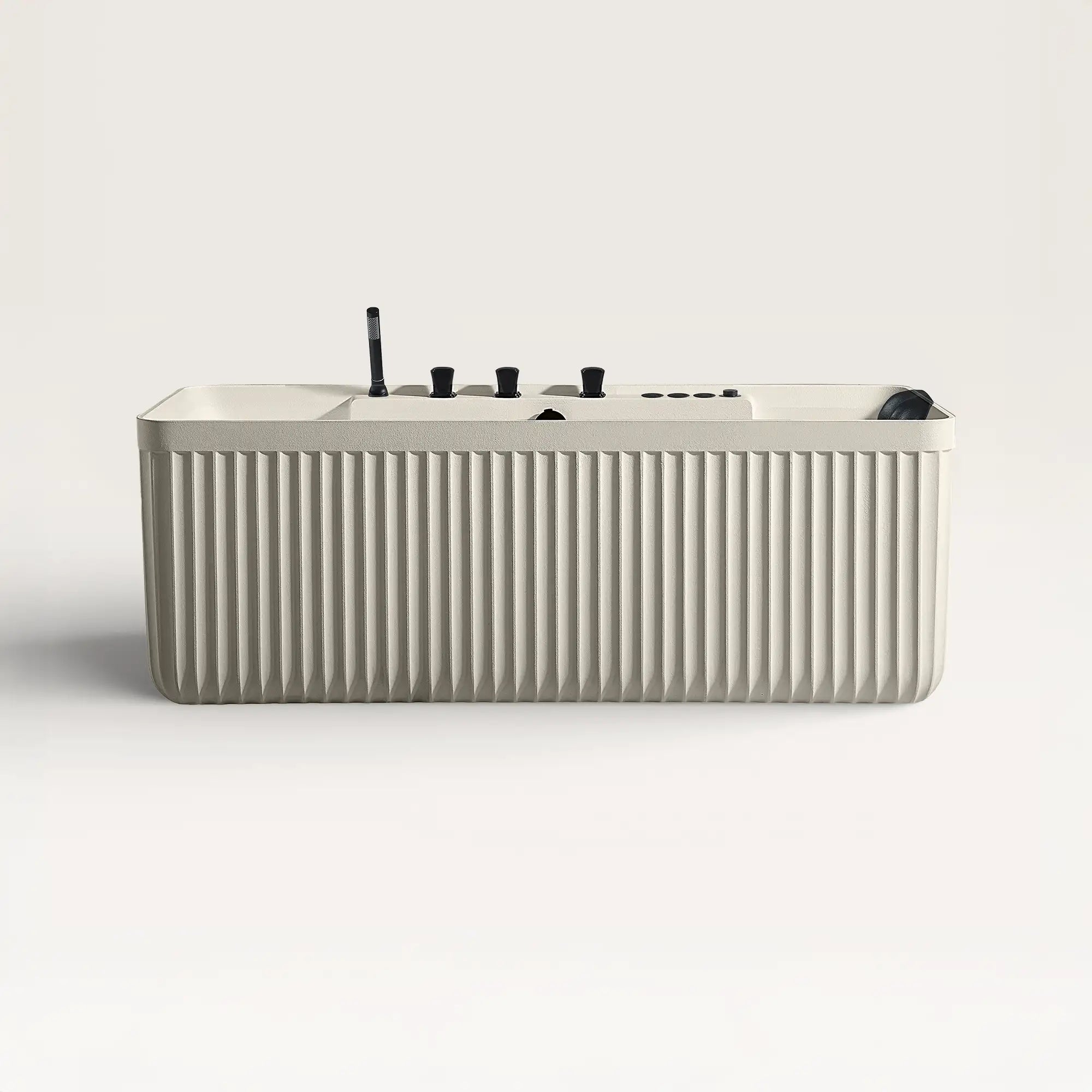 Front view of the Kolpa Spa bath with black tapware in cream