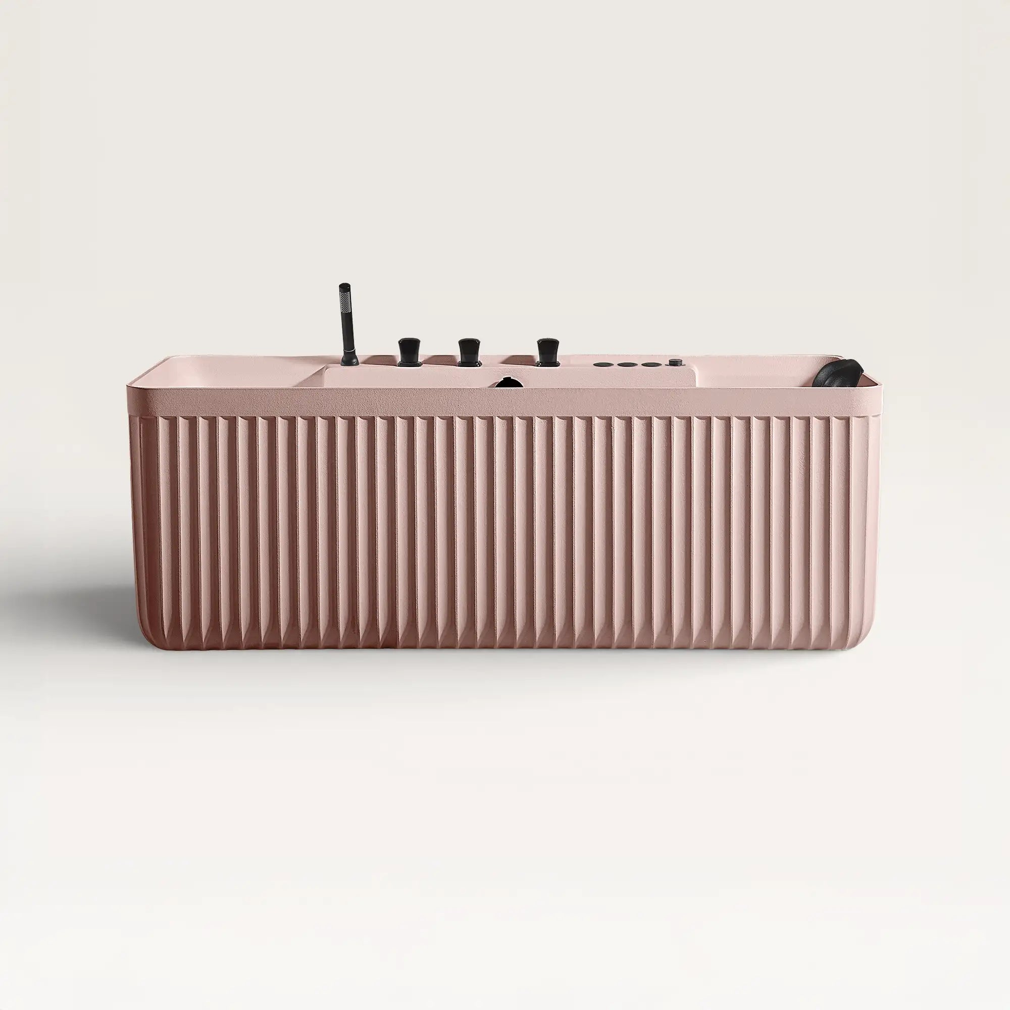 Front view of the Kolpa Spa bath with black tapware in pink