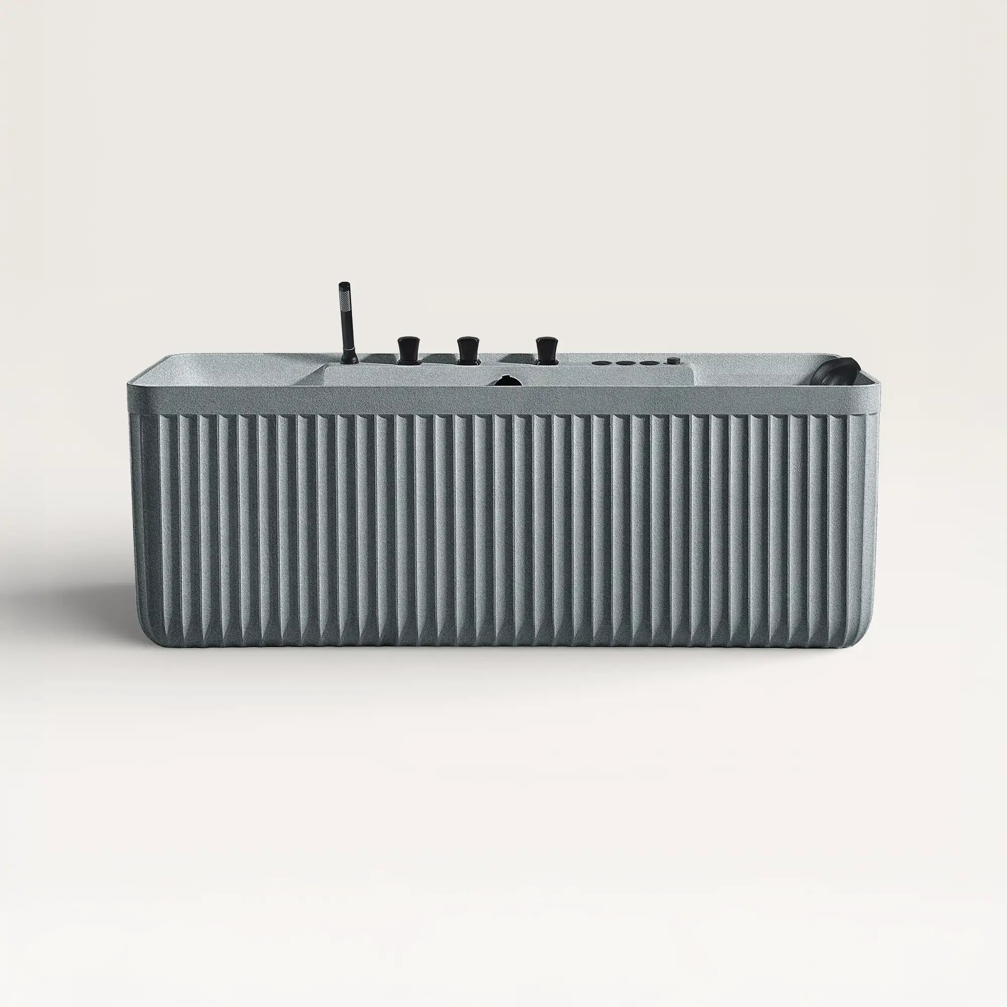 Front view of the Kolpa Spa bath with black tapware in granite-grey