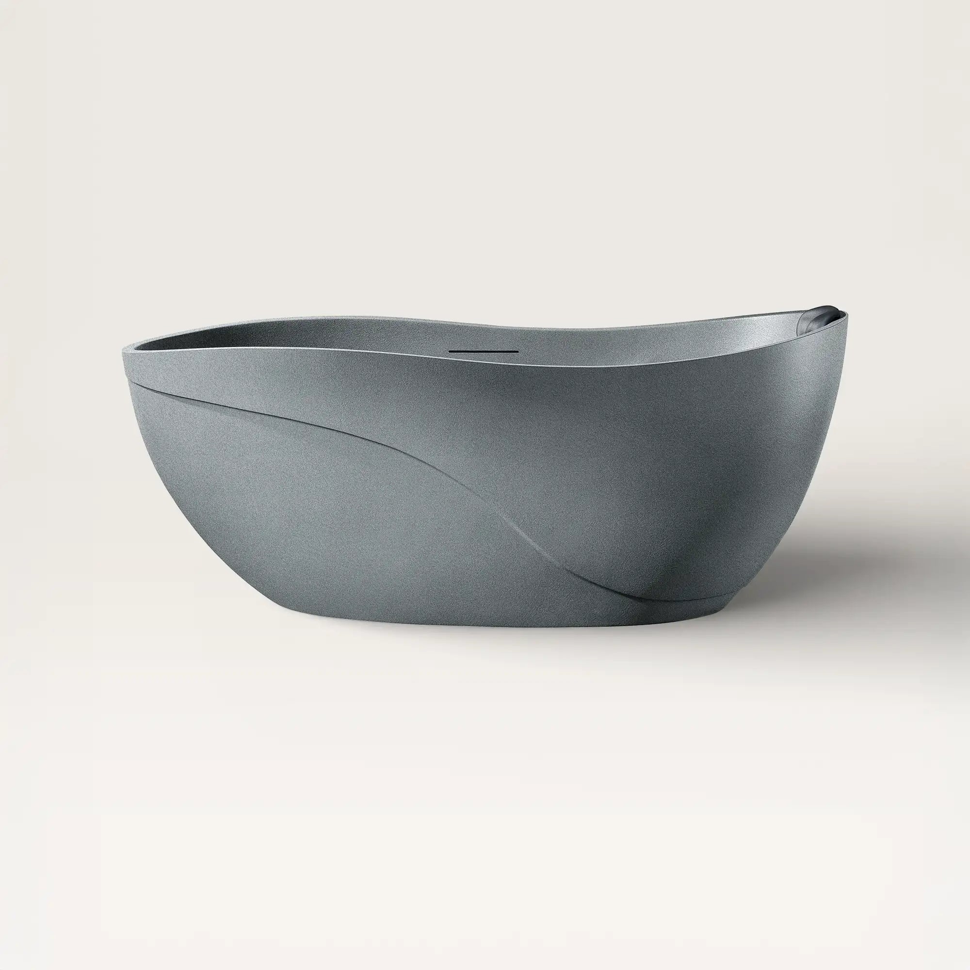Front view of the Soma freestanding bath in granite-grey with a black magnetic pillow