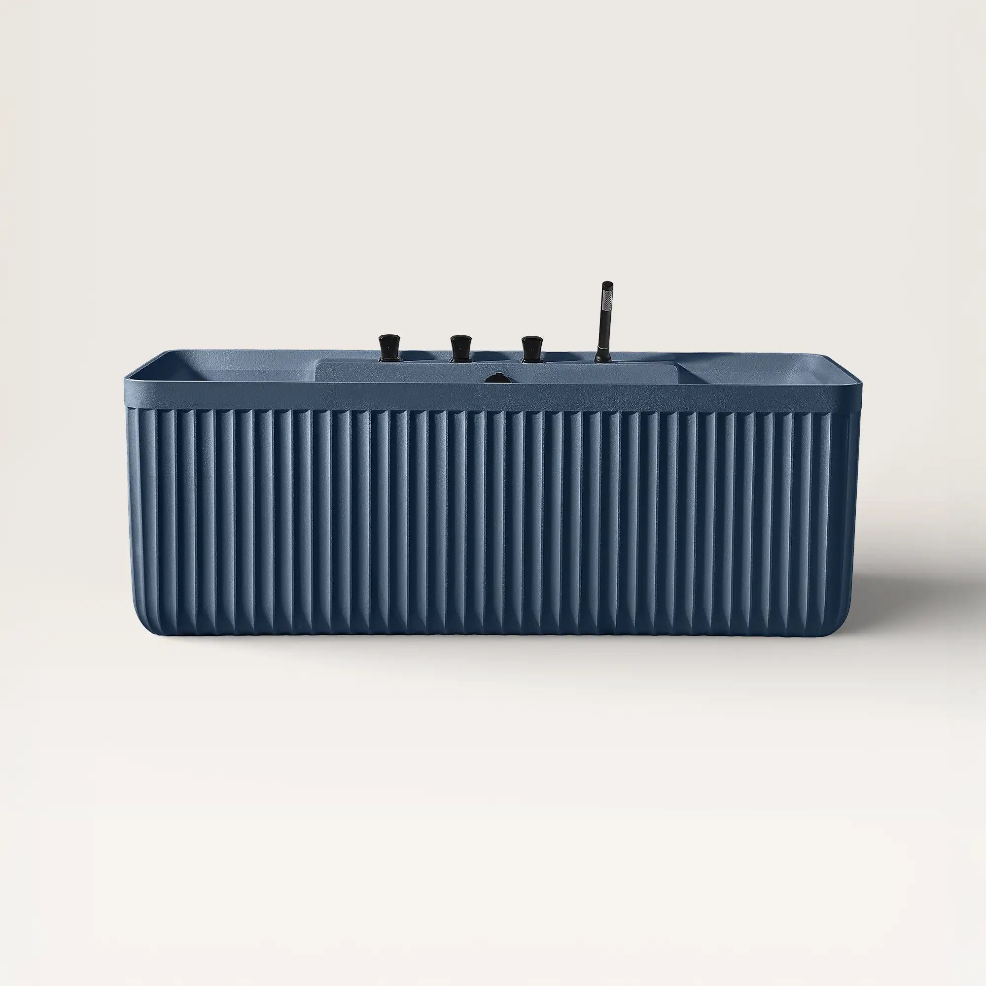 Front view of the Kolpa back-to wall bath with black tapware in prussian blue