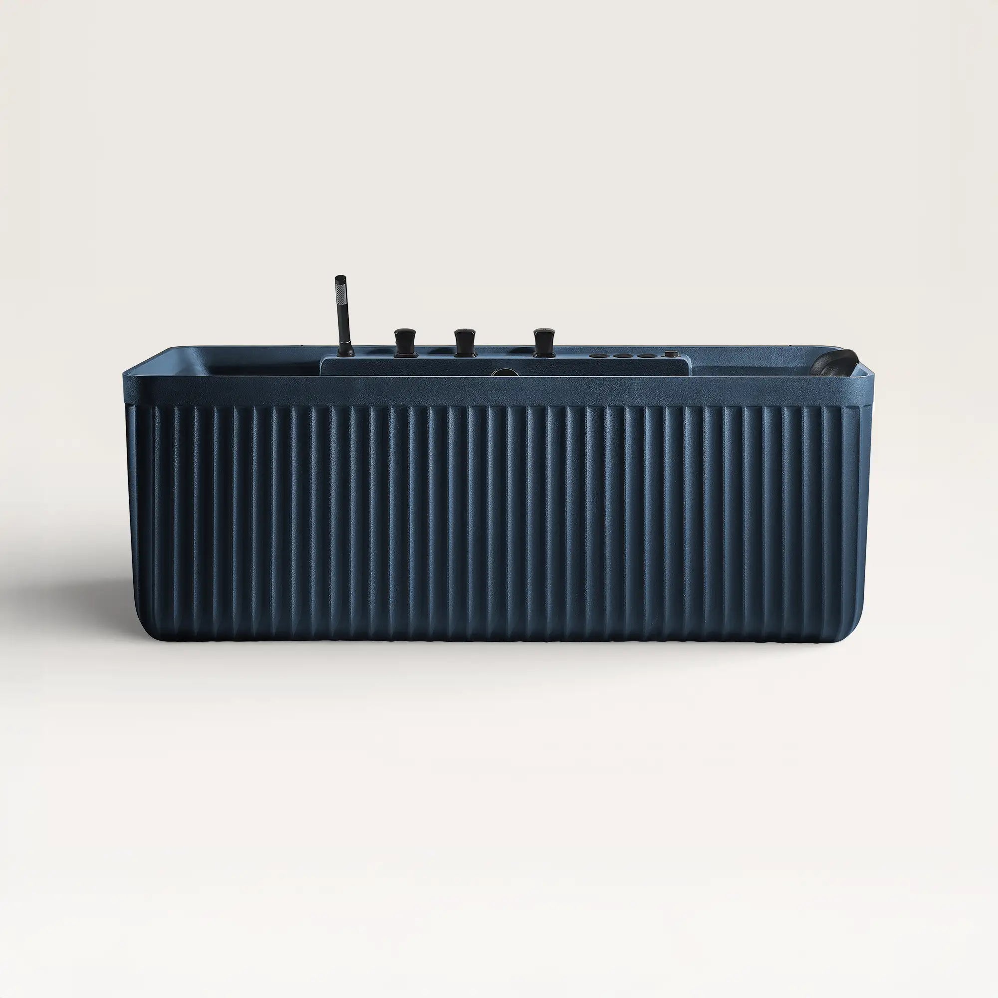 Front view of the Kolpa Spa bath with black tapware in prussian blue