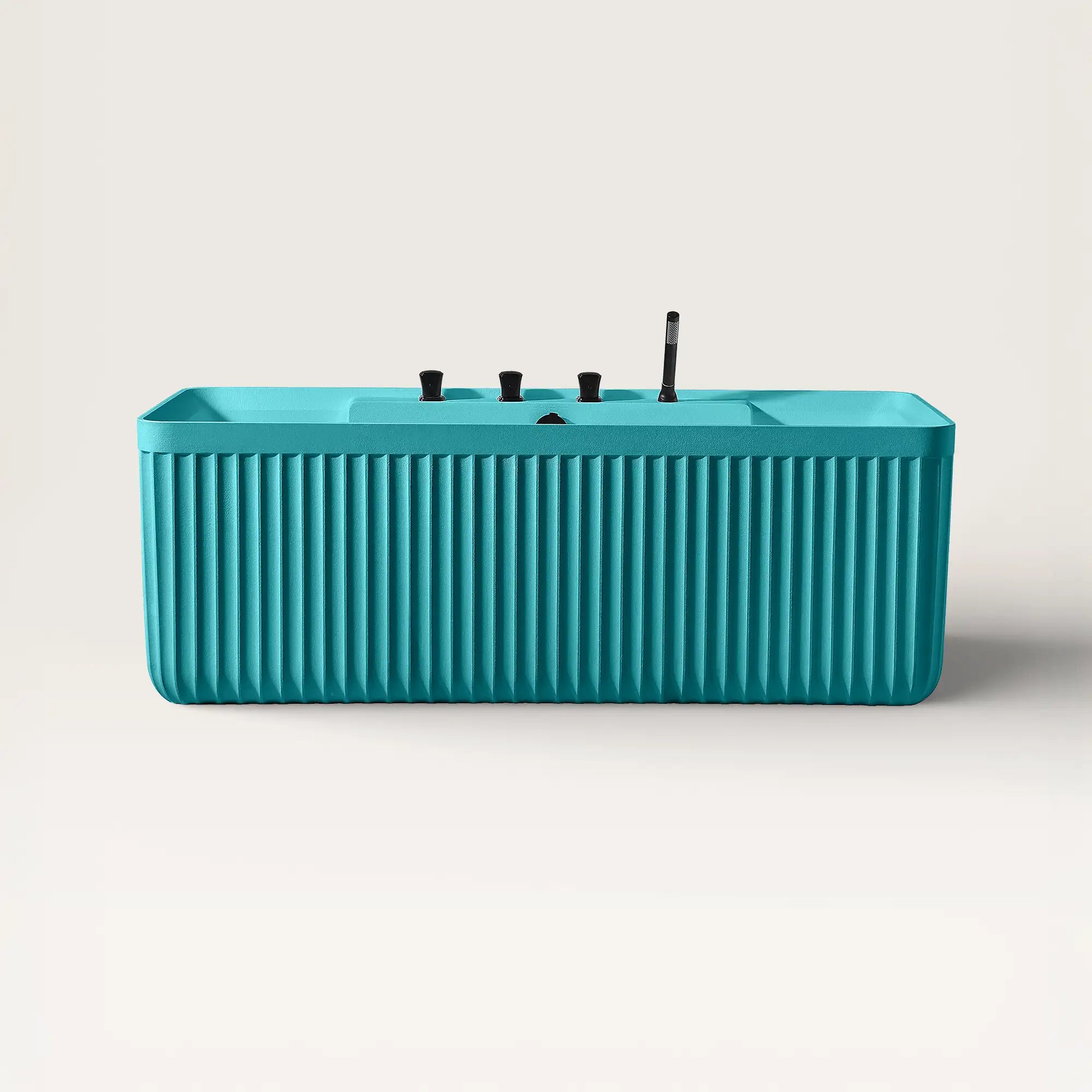 Front view of the Kolpa back-to wall bath with black tapware in celadon blue.