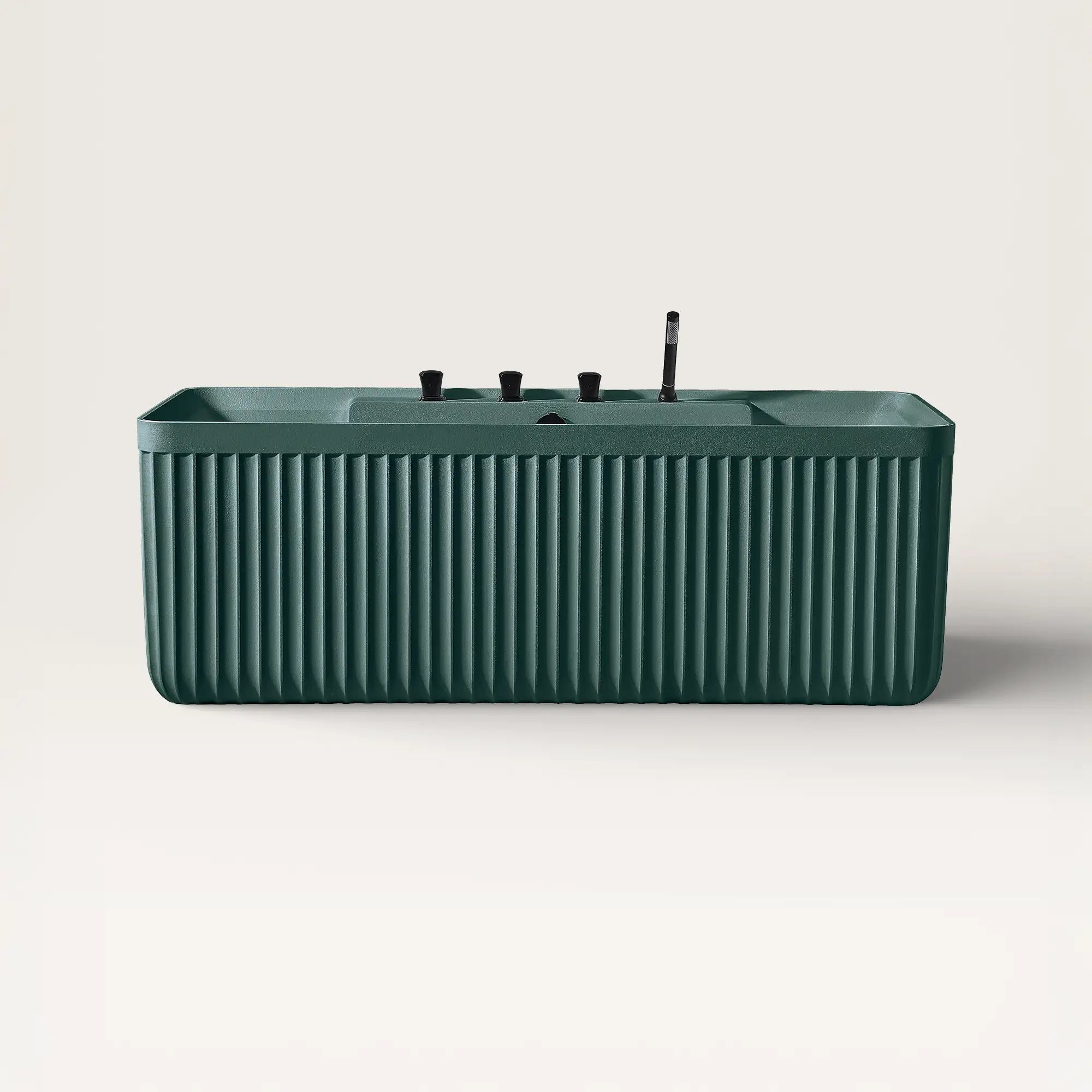 Front view of the Kolpa back-to wall bath with black tapware in green