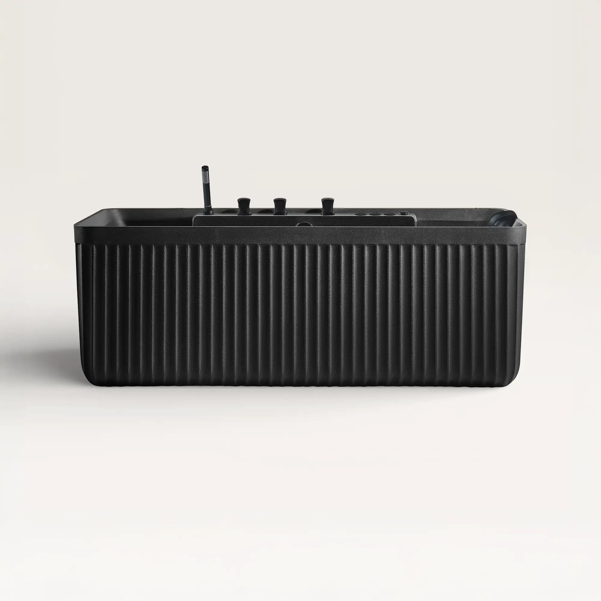 Front view of the Kolpa Spa bath with black tapware in black