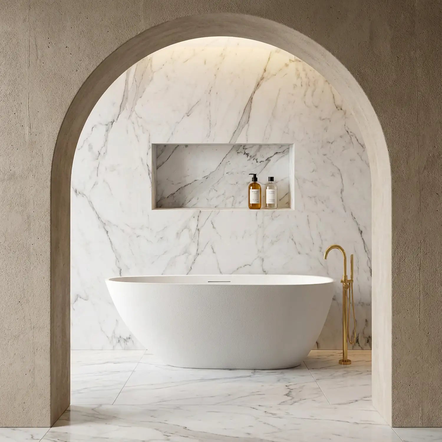 Modern bathroom with the ARIA 1700mm freestanding bathtub in white, marble walls, and gold fixtures.