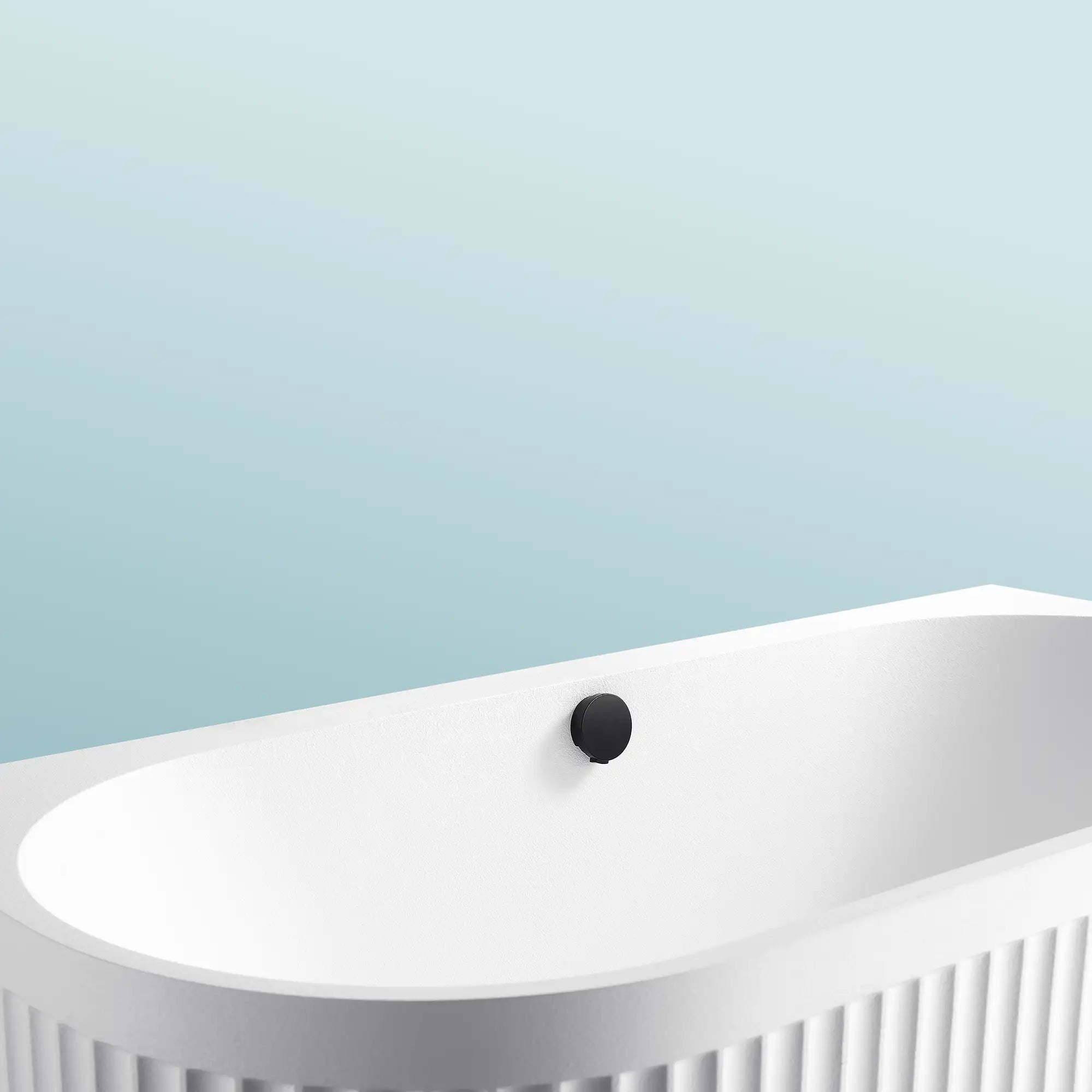 A close-up of the Doria back-to-wall bathtub in white on a blue background