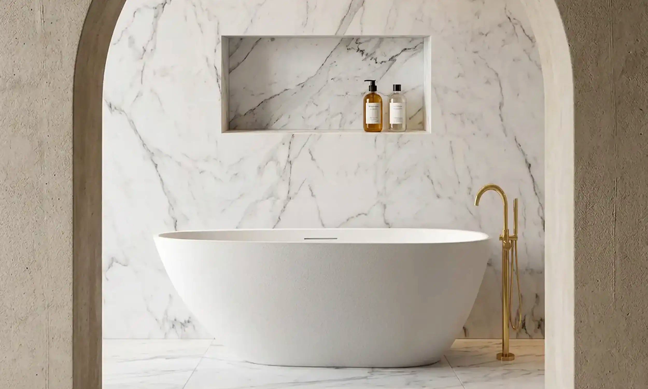 Modern bathroom with the freestanding ARIA bath in white, marble walls, and a neutral color palette.
