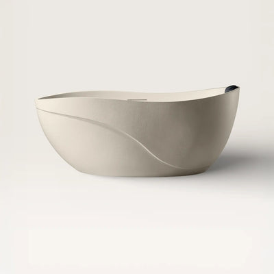 Front view of the Soma freestanding bath in cream with a black magnetic pillow