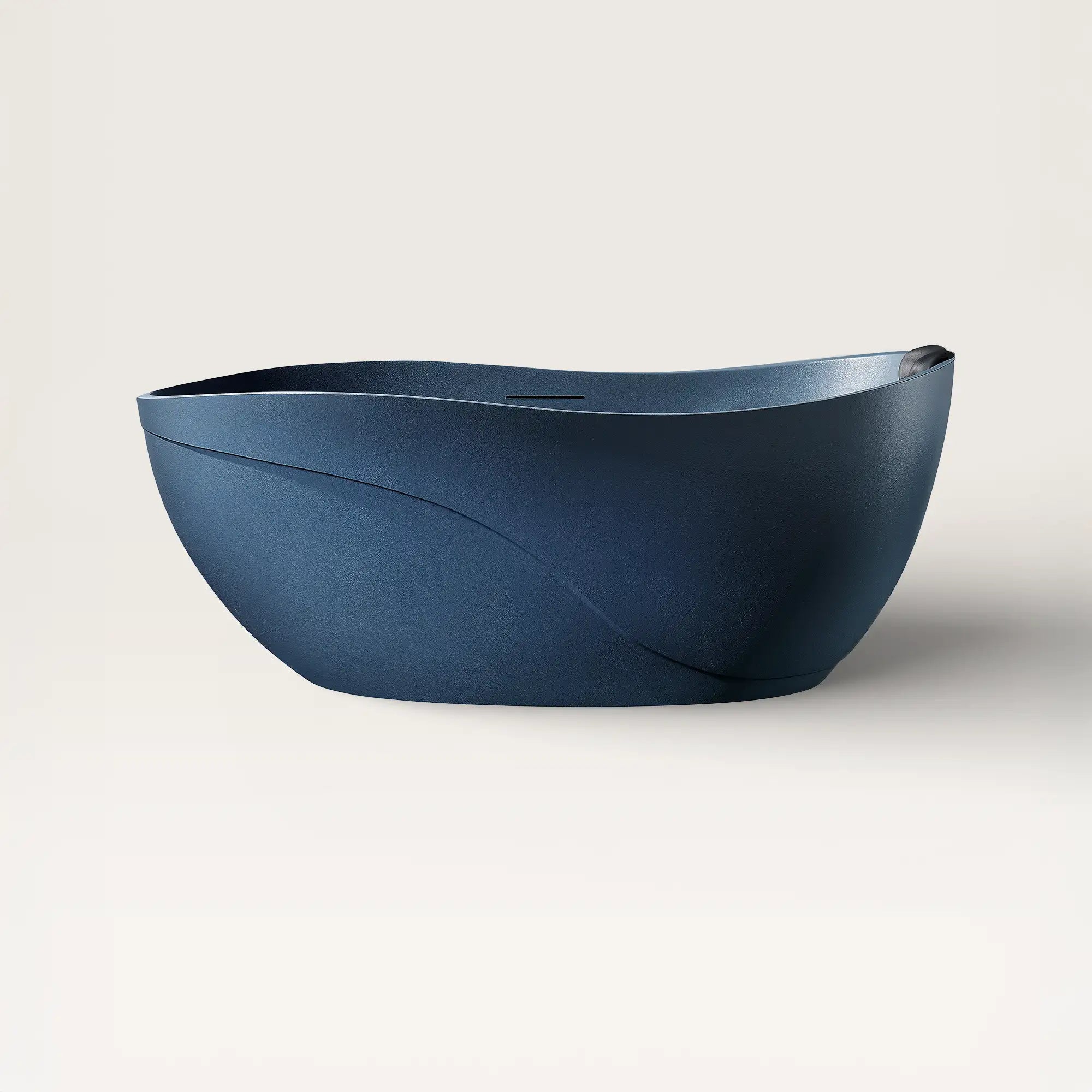 Front view of the Soma freestanding bath in prussian blue with a black magnetic pillow