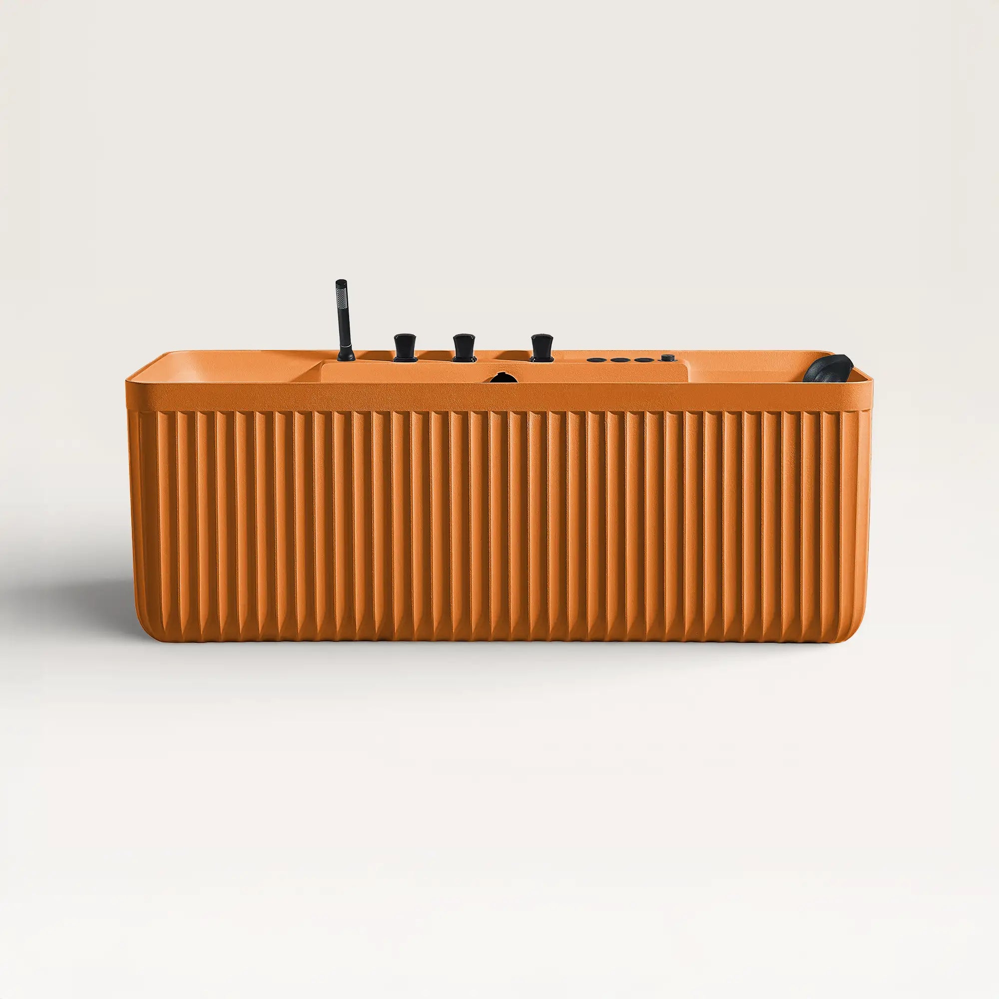 Front view of the Kolpa Spa bath with black tapware in orange