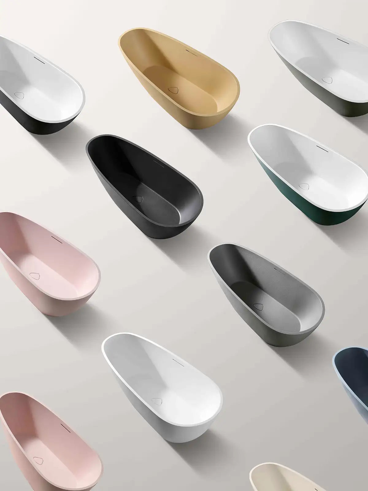 Collection of colorful Bellastone bathtubs on a light gray background