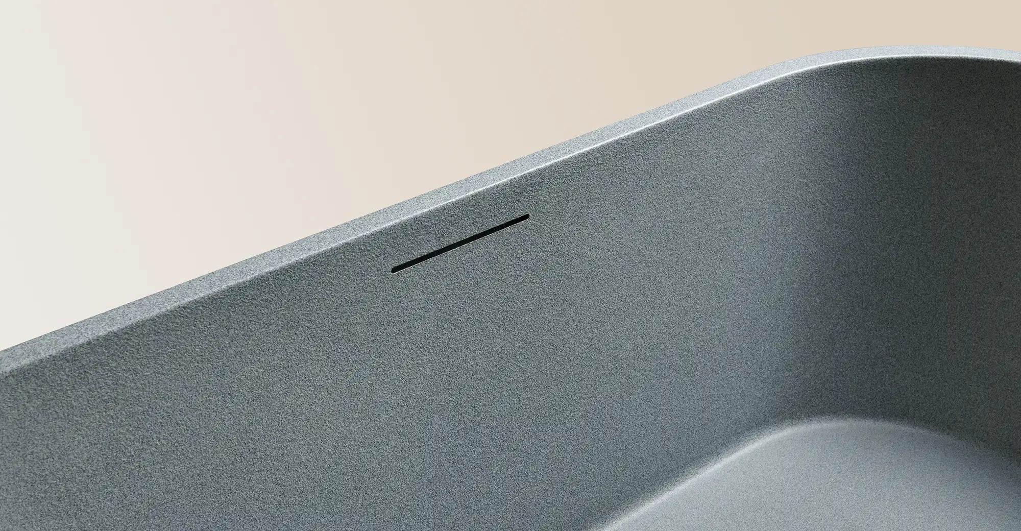 Close-up of a Bellastone bath in Granite Grey, showing its smooth slate-like texture.